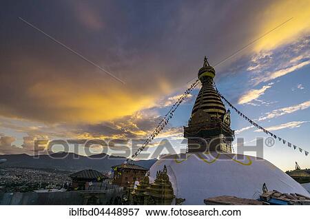 Stupa of Swayambhunath temple, Monkey Temple, decorated with tibetan prayer flags, orange clouds above, Kathmandu, Nepal, Asia View Large Photo Image Stock Photo - Stupa of Swayambhunath temple, Monkey Temple, decorated with tibetan prayer flags, orange clouds above, Kathmandu, Nepal, Asia. Fotosearch