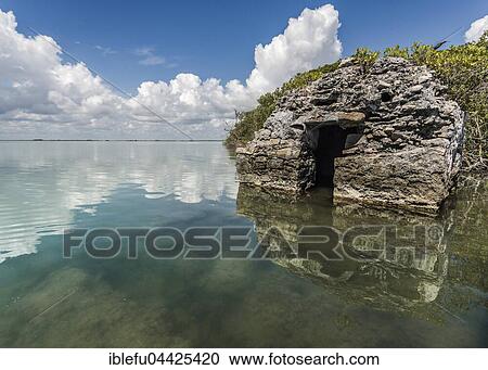 Sunken boulders with water reflection, Capechen Lagoon, Sian Ka'an Biosphere Reserve, Tulum, Quintana Roo, Yucatan, Mexico, Central America View Large Photo Image Stock Image - Sunken boulders with water reflection, Capechen Lagoon, Sian Ka'an Biosphere Reserve, Tulum, Quintana Roo, Yucatan, Mexico, Central America. Fotosearch