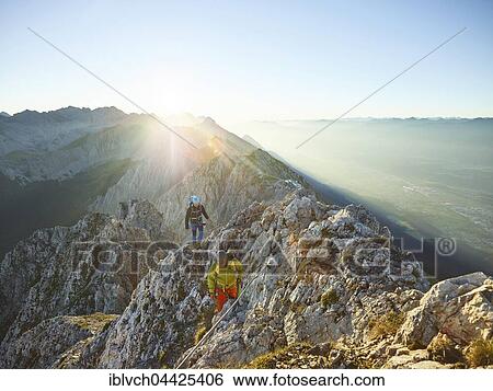 Sunrise on ridge, via ferrata, two climbers attached to steel cable, Nordkette Innsbruck, Tyrol, Austria, Europe View Large Photo Image Stock Photograph - Sunrise on ridge, via ferrata, two climbers attached to steel cable, Nordkette Innsbruck, Tyrol, Austria, Europe. Fotosearch