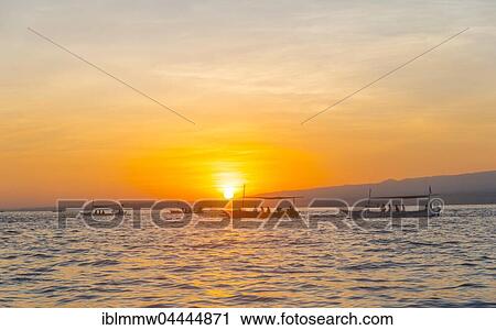 Sunrise, outrigger canoes in the sea, Lovina Beach, Bali, Indonesia, Asia View Large Photo Image Stock Image - Sunrise, outrigger canoes in the sea, Lovina Beach, Bali, Indonesia, Asia. Fotosearch