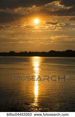 Sunset, River Zambezi, Katima Mulilo, Caprivi Strip, Namibia, Africa View Large Photo Image Stock Image - Sunset, River Zambezi, Katima Mulilo, Caprivi Strip, Namibia, Africa. Fotosearch