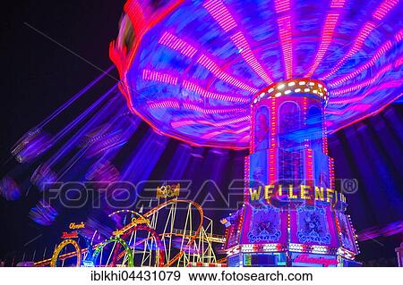 Swings carousel in motion, night scene, Oktoberfest, Munich, Bavaria, Germany, Europe View Large Photo Image Stock Photo - Swings carousel in motion, night scene, Oktoberfest, Munich, Bavaria, Germany, Europe. Fotosearch