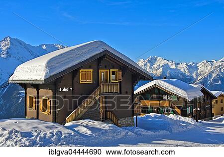 Swiss chalet with a thick layer of snow on the roof with Fletschhorn, Bettmeralp, Valais, Switzerland, Europe View Large Photo Image Stock Image - Swiss chalet with a thick layer of snow on the roof with Fletschhorn, Bettmeralp, Valais, Switzerland, Europe. Fotosearch