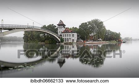 Stock Image - The Abbey Bridge connects Berlin Treptow Köpenick across the Spree with the Island of Youth, Alt-Treptow, Berlin. Fotosearch