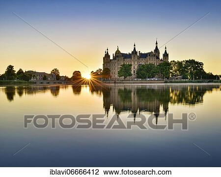 The Schwerin Castle at the Schwerin Lake at sunrise, Schwerin, Mecklenburg-Western Pomerania, Germany, Europe View Large Photo Image Stock Image - The Schwerin Castle at the Schwerin Lake at sunrise, Schwerin, Mecklenburg-Western Pomerania, Germany, Europe. Fotosearch
