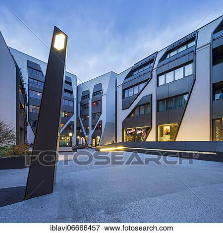 Stock Photo - The Sonnenhof at dusk, office and residential building, modern architecture, Jena, Thuringia, Germany, Europe. Fotosearch