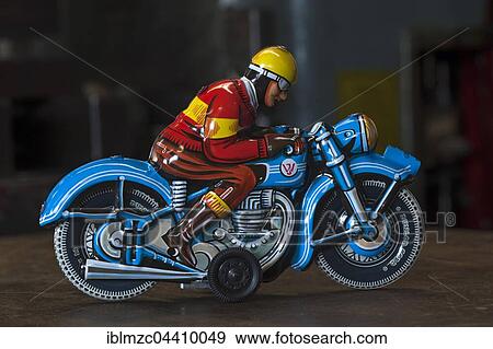 Tin Toys from the 1950s, finished motorcyclists in front of an old squeezing machine in the factory, tin toys, Emskirchen, Brunn, Upper Franconia, Bavaria, Germany, Europe View Large Photo Image Stock Photo - Tin Toys from the 1950s, finished motorcyclists in front of an old squeezing machine in the factory, tin toys, Emskirchen, Brunn, Upper Franconia, Bavaria, Germany, Europe. Fotosearch