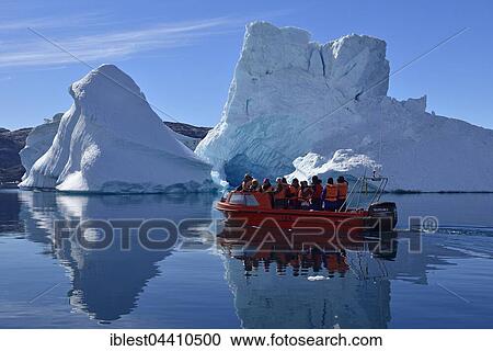 Tourist boat cruising through the icebergs, Sermilik Fjord, Kalaallit Nunaat, East Greenland View Large Photo Image Stock Image - Tourist boat cruising through the icebergs, Sermilik Fjord, Kalaallit Nunaat, East Greenland. Fotosearch