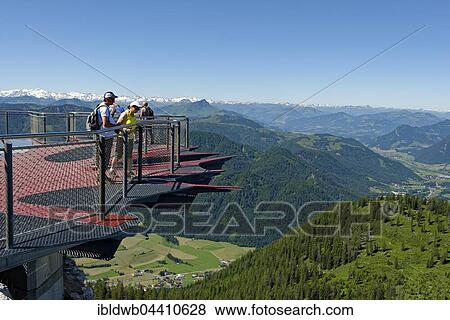Tourists looking over the edge of the viewing platform, Triassic Park, Steinplatte, near Waidring, Tyrol, Austria, Europe View Large Photo Image Stock Photo - Tourists looking over the edge of the viewing platform, Triassic Park, Steinplatte, near Waidring, Tyrol, Austria, Europe. Fotosearch