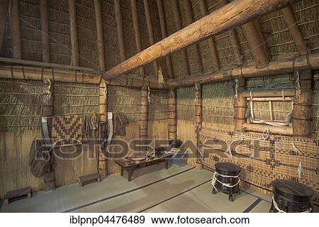 Stock Photo - Traditional Ainu home interior made by straw, traditional Ainu 'chise' house made of wood and thatch, Kamikawa, Hokkaido, Japan, Asia. Fotosearch