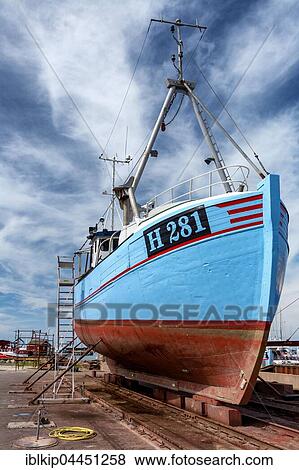 Stock Photo - Traditional Danish fishing boat in ship repair yard, Gilleleje, Denmark, Europe. Fotosearch
