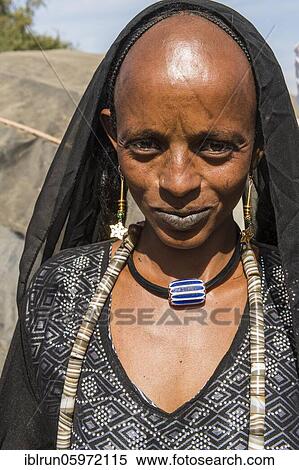 Stock Photography - Traditional dressed woman, Sahel, Chad, Africa. Fotosearch