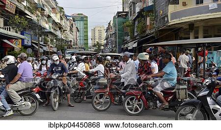 Traffic, many mopeds at an intersection, Phnom Penh, Cambodia, Asia View Large Photo Image Stock Photo - Traffic, many mopeds at an intersection, Phnom Penh, Cambodia, Asia. Fotosearch