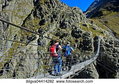 Trift Bridge, longest pedestrian-only suspension bridge in Swiss Alps, Trift Gorge, Gadmer Valley, Gadmen, Bern Canton, Switzerland, Europe View Large Photo Image Stock Image - Trift Bridge, longest pedestrian-only suspension bridge in Swiss Alps, Trift Gorge, Gadmer Valley, Gadmen, Bern Canton, Switzerland, Europe. Fotosearch