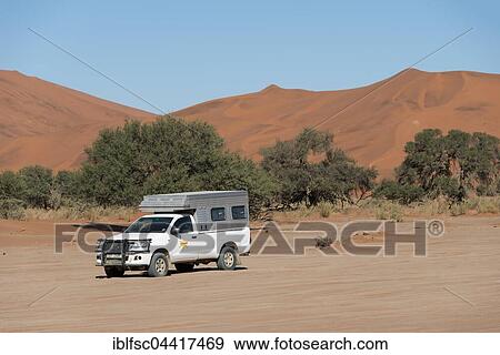 Stock Photo - Truck on dirt road in the Namib-Naukluft National Park, Namib Desert, Namibia, Africa. Fotosearch