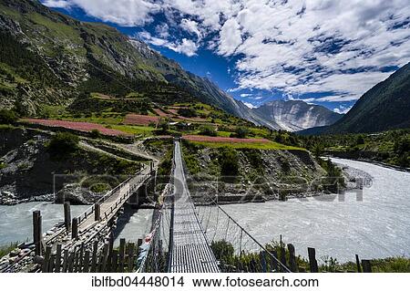 Two bridges are crossing the Marsyangdi river, Lower Pisang, Manang District, Nepal, Asia View Large Photo Image Picture - Two bridges are crossing the Marsyangdi river, Lower Pisang, Manang District, Nepal, Asia. Fotosearch