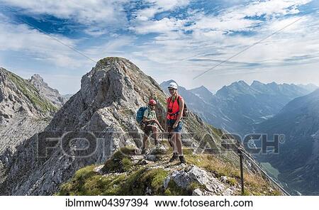 Two female hikers on trail, Mittenwalder Höhenweg, Karwendel, Mittenwald, Germany, Europe View Large Photo Image Picture - Two female hikers on trail, Mittenwalder Höhenweg, Karwendel, Mittenwald, Germany, Europe. Fotosearch