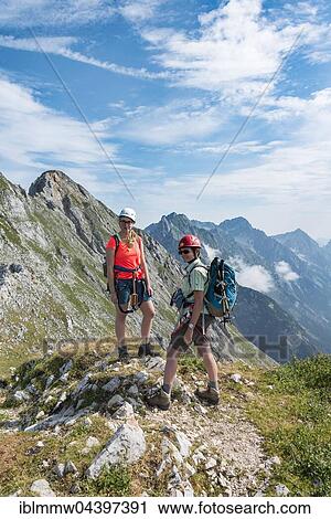 Two female hikers on trail, Mittenwalder Höhenweg, Karwendel, Mittenwald, Germany, Europe View Large Photo Image Stock Image - Two female hikers on trail, Mittenwalder Höhenweg, Karwendel, Mittenwald, Germany, Europe. Fotosearch