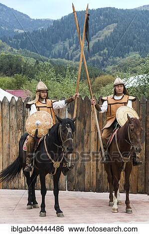 Two men on horseback in front of the entrance to the Kazakh ethnographic village aul Gunny, Talgar, Almaty, Kazakhstan, Asia View Large Photo Image Stock Photograph - Two men on horseback in front of the entrance to the Kazakh ethnographic village aul Gunny, Talgar, Almaty, Kazakhstan, Asia. Fotosearch