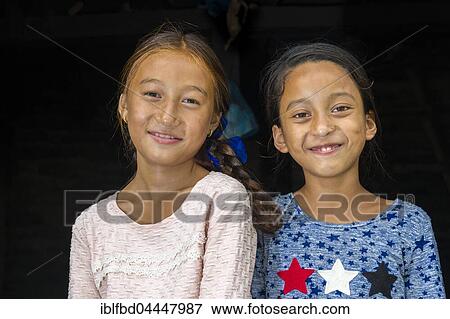 Two smiling girls, Portrait, Upper Marsyangdi valley, Tal, Lamjung District, Nepal, Asia View Large Photo Image Stock Photo - Two smiling girls, Portrait, Upper Marsyangdi valley, Tal, Lamjung District, Nepal, Asia. Fotosearch