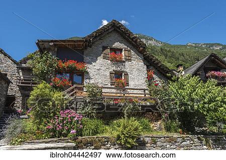 Typical stone house in Sonogno, Valle Verzasca, Canton of Ticino, Switzerland, Europe View Large Photo Image Stock Photo - Typical stone house in Sonogno, Valle Verzasca, Canton of Ticino, Switzerland, Europe. Fotosearch