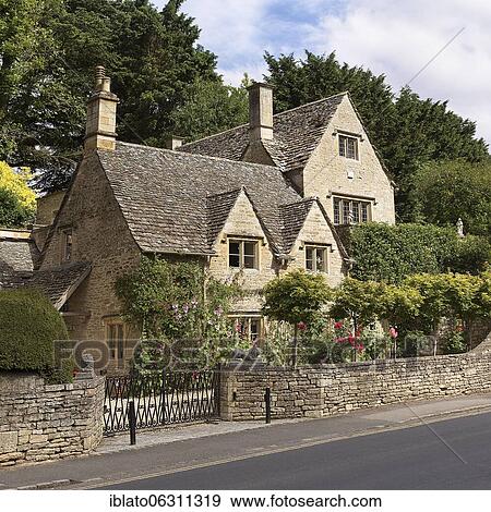 Typical stone house of the Cotswolds, Bibury, Cotswolds, Gloucestershire, England, Great Britain View Large Photo Image Stock Photo - Typical stone house of the Cotswolds, Bibury, Cotswolds, Gloucestershire, England, Great Britain. Fotosearch