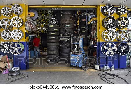Tyres and wheels, car workshop, Phnom Penh, Cambodia, Asia View Large Photo Image Stock Photography - Tyres and wheels, car workshop, Phnom Penh, Cambodia, Asia. Fotosearch