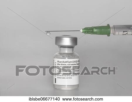 Vaccine vial against Covid 19 and syringe with drops, Biontech, Pfizer, Pfizer-BioNTech View Large Photo Image Stock Image - Vaccine vial against Covid 19 and syringe with drops, Biontech, Pfizer, Pfizer-BioNTech. Fotosearch