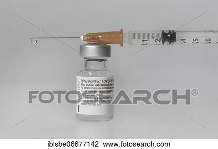 Vaccine vial against Covid 19 and syringe with drops, Biontech, Pfizer, Pfizer-BioNTech View Large Photo Image Stock Image - Vaccine vial against Covid 19 and syringe with drops, Biontech, Pfizer, Pfizer-BioNTech. Fotosearch