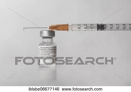 Vaccine vial against Covid 19 and syringe with drops, Biontech, Pfizer, Pfizer-BioNTech View Large Photo Image Stock Photograph - Vaccine vial against Covid 19 and syringe with drops, Biontech, Pfizer, Pfizer-BioNTech. Fotosearch