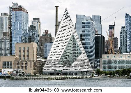 VIA 57 West, pyramid shaped apartment building, with skyline, architects Bjarke Ingels Group, Hudson River, Hell's Kitchen, Manhattan, New York, USA, North America View Large Photo Image Stock Photo - VIA 57 West, pyramid shaped apartment building, with skyline, architects Bjarke Ingels Group, Hudson River, Hell's Kitchen, Manhattan, New York, USA, North America. Fotosearch