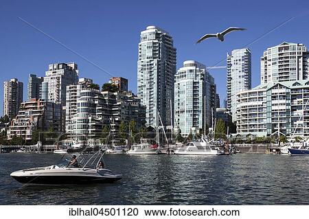 Stock Image - View from Granville Island across False Creek onto the skyline of Vancouver, British Columbia Province, Canada, North America. Fotosearch
