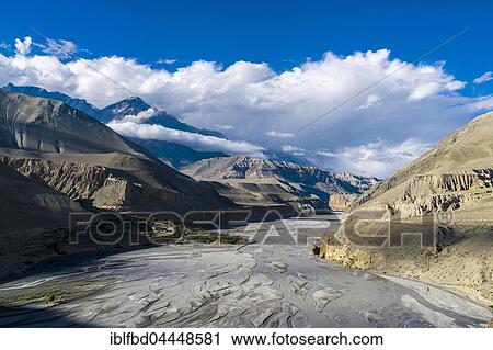 View of Kali Gandaki valley towards Upper Mustang, village of Tiri located on green peninsula, Tiri, Mustang District, Nepal, Asia View Large Photo Image Stock Image - View of Kali Gandaki valley towards Upper Mustang, village of Tiri located on green peninsula, Tiri, Mustang District, Nepal, Asia. Fotosearch