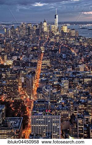 Stock Photo - View of Lower Manhattan from the Empire State Building at dusk, New York City, USA, North America. Fotosearch