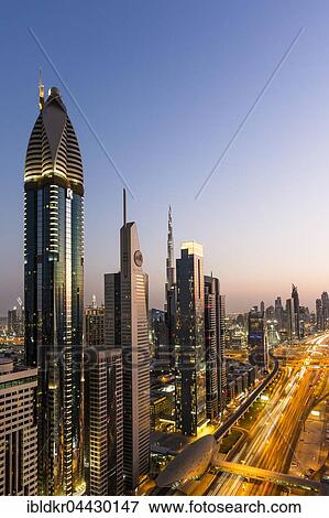Stock Photo - View of sunset from Four Points by Sheraton, skyline and Sheikh Zayed Road, Downtown Dubai, United Arab Emirates, Asia. Fotosearch