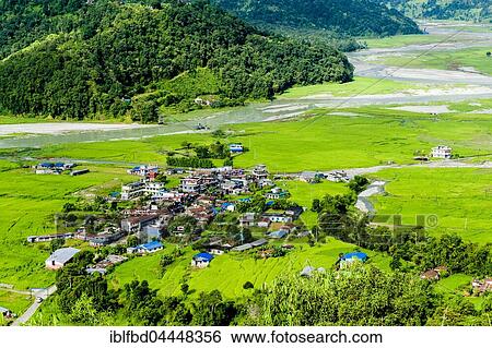 View on the village, agricultural landscape with rice fields and the meandering Harpan Khola river, Pame, Kaski District, Nepal, Asia View Large Photo Image Stock Photograph - View on the village, agricultural landscape with rice fields and the meandering Harpan Khola river, Pame, Kaski District, Nepal, Asia. Fotosearch