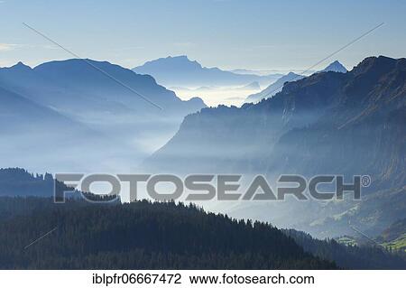 Stock Image - View over the Muota valley with Pilatus and Fronalpstock, Schwyz, Switzerland, Europe. Fotosearch