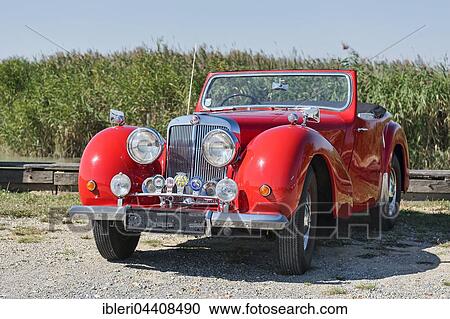 Vintage Triumph Roadster 2000, built in 1948, 4 cylinders, displacement 2000cc, 3 forward gears, 60 hp, 100 km/h, aluminum body View Large Photo Image Stock Image - Vintage Triumph Roadster 2000, built in 1948, 4 cylinders, displacement 2000cc, 3 forward gears, 60 hp, 100 km/h, aluminum body. Fotosearch