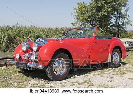Stock Photo - Vintage Triumph Roadster 2000, built in 1948, 4 cylinders, displacement 2000cc, weight 1110kg, 3 forward gears, 60 hp, 100 km/h, aluminum body. Fotosearch