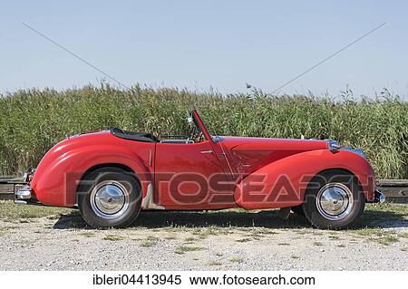 Vintage Triumph Roadster 2000, built in 1948, 4 cylinders, displacement 2000cc, weight 1110kg, 3 forward gears, 60 hp, 100 km/h, aluminum body View Large Photo Image Stock Photography - Vintage Triumph Roadster 2000, built in 1948, 4 cylinders, displacement 2000cc, weight 1110kg, 3 forward gears, 60 hp, 100 km/h, aluminum body. Fotosearch
