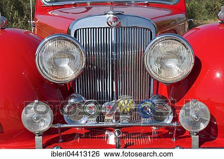 Vintage Triumph Roadster 2000, radiator, built in 1948, 4 cylinders, displacement 2000cc, 3 forward gears, 60 hp, 100 km/h, aluminum body View Large Photo Image Stock Photograph - Vintage Triumph Roadster 2000, radiator, built in 1948, 4 cylinders, displacement 2000cc, 3 forward gears, 60 hp, 100 km/h, aluminum body. Fotosearch