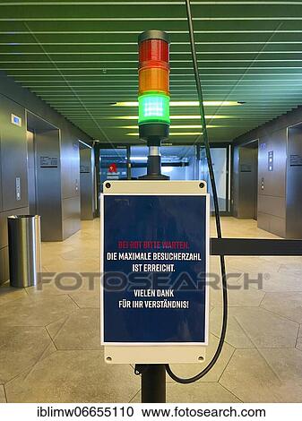 Visitor counter, Corona traffic light for recording the number of visitors at the entrance of a shopping centre, Corona crisis, Stuttgart, Baden-Württemberg, Germany, Europe View Large Photo Image Stock Image - Visitor counter, Corona traffic light for recording the number of visitors at the entrance of a shopping centre, Corona crisis, Stuttgart, Baden-Württemberg, Germany, Europe. Fotosearch