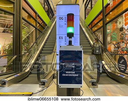 Visitor counter, Corona traffic light for recording the number of visitors at the entrance of a shopping centre, Corona crisis, Stuttgart, Baden-Württemberg, Germany, Europe View Large Photo Image Stock Photo - Visitor counter, Corona traffic light for recording the number of visitors at the entrance of a shopping centre, Corona crisis, Stuttgart, Baden-Württemberg, Germany, Europe. Fotosearch