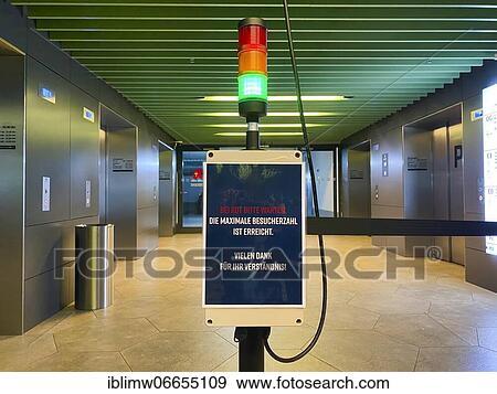 Visitor counter, Corona traffic light for recording the number of visitors at the entrance of a shopping centre, Corona crisis, Stuttgart, Baden-Württemberg, Germany, Europe View Large Photo Image Stock Photo - Visitor counter, Corona traffic light for recording the number of visitors at the entrance of a shopping centre, Corona crisis, Stuttgart, Baden-Württemberg, Germany, Europe. Fotosearch
