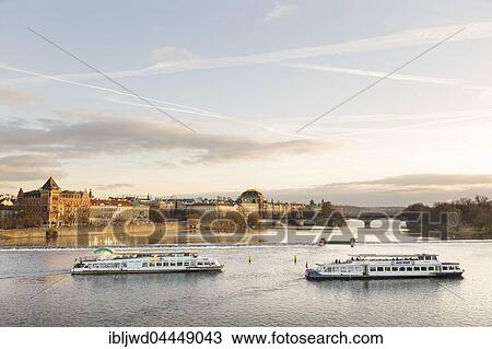 Stock Image - Vltava River with Old Town from Charles Bridge, with tourist boats, Prague, Czech Republic, Europe. Fotosearch