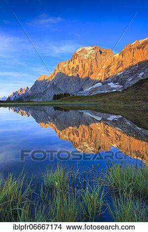 Wellhorn and Engelhörner with mountain lake, Bernese Oberland, Switzerland, Europe View Large Photo Image Picture - Wellhorn and Engelhörner with mountain lake, Bernese Oberland, Switzerland, Europe. Fotosearch