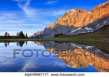 Stock Image - Wellhorn and Engelhörner with mountain lake, Bernese Oberland, Switzerland, Europe. Fotosearch