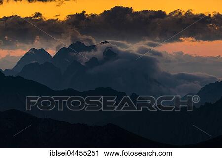 Wetterstein mountains, dark clouds at sunrise, Elemen, Lechtal, Bezirk Reutte, Tyrol, Austria, Europe View Large Photo Image Stock Image - Wetterstein mountains, dark clouds at sunrise, Elemen, Lechtal, Bezirk Reutte, Tyrol, Austria, Europe. Fotosearch