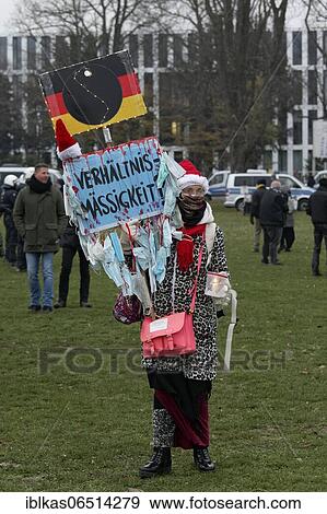 Whimsical costumed woman with banner Verhälltnismäßigkeit, demonstration against Corona measures on the Rhine meadows on Dec. 6, 2020, Düsseldorf, North Rhine-Westphalia, Germany, Europe View Large Photo Image Stock Photo - Whimsical costumed woman with banner Verhälltnismäßigkeit, demonstration against Corona measures on the Rhine meadows on Dec. 6, 2020, Düsseldorf, North Rhine-Westphalia, Germany, Europe. Fotosearch