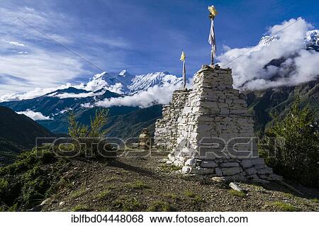 White chorten on a hill above Manang, behind Annapurna Range, Manang, Manang District, Nepal, Asia View Large Photo Image Stock Photo - White chorten on a hill above Manang, behind Annapurna Range, Manang, Manang District, Nepal, Asia. Fotosearch